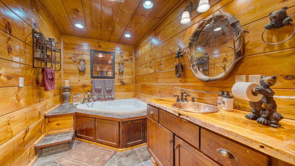 911 Summit Way Blairsville, GA 30512 - Photo 15 of 23 a bathroom with a sink and a mirror