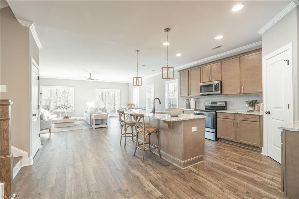 2063 Welden Ridge Road Kernersville, NC 27284 - Photo 6 of 49 Enter into the beautiful kitchen that opens perfectly to the living/dining area.
