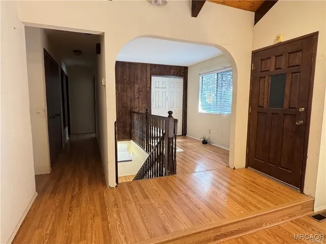 a kitchen with a refrigerator and a sink