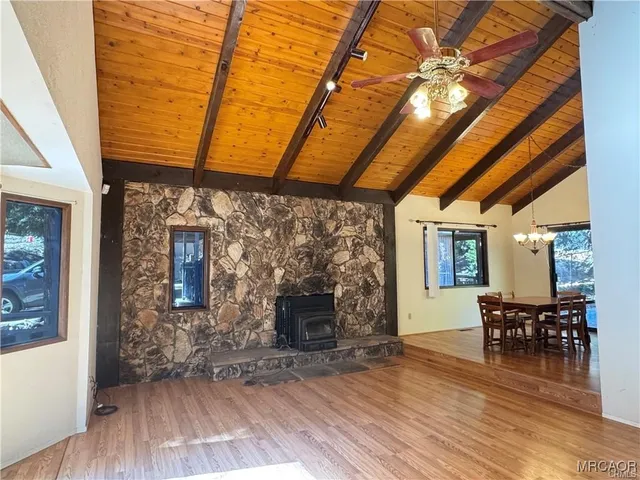 a view of a window and a microwave in a kitchen