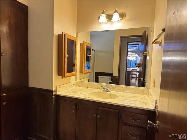 a bathroom with a glass shower door
