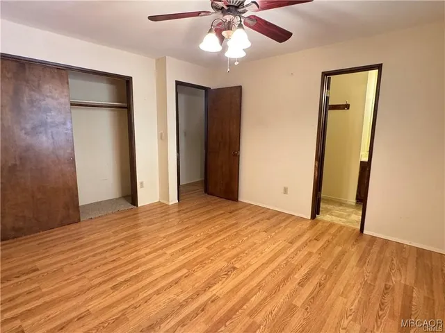 a view of a house with wooden deck and a yard
