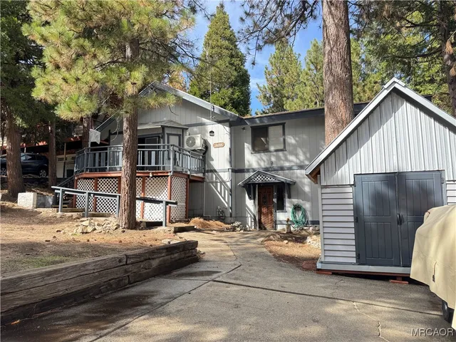 a view of a room with wooden floor and stairs