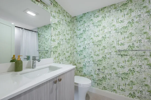 a bathroom with a sink and a toilet