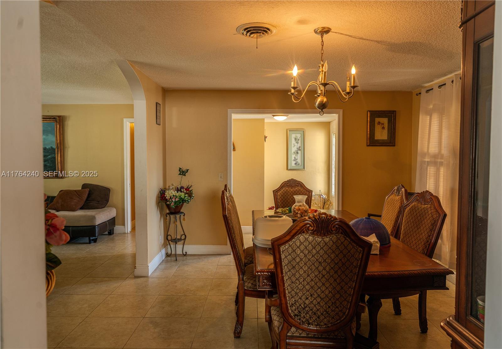 315 Southwest 12th Avenue Boynton Beach, FL 33435 - Photo 11 of 37 a view of a livingroom with furniture and a chandelier