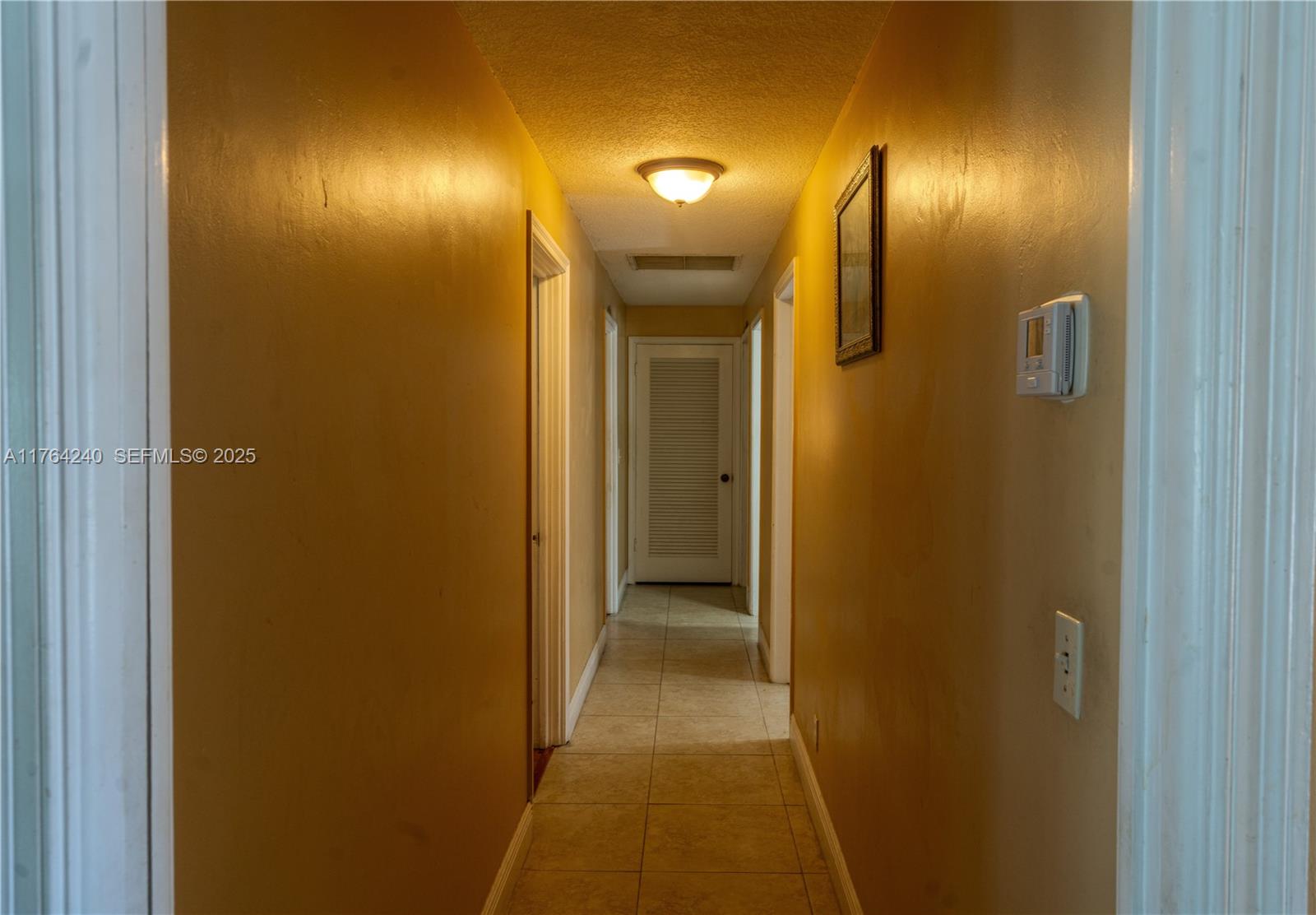 315 Southwest 12th Avenue Boynton Beach, FL 33435 - Photo 15 of 37 a view of a hallway with a bathroom