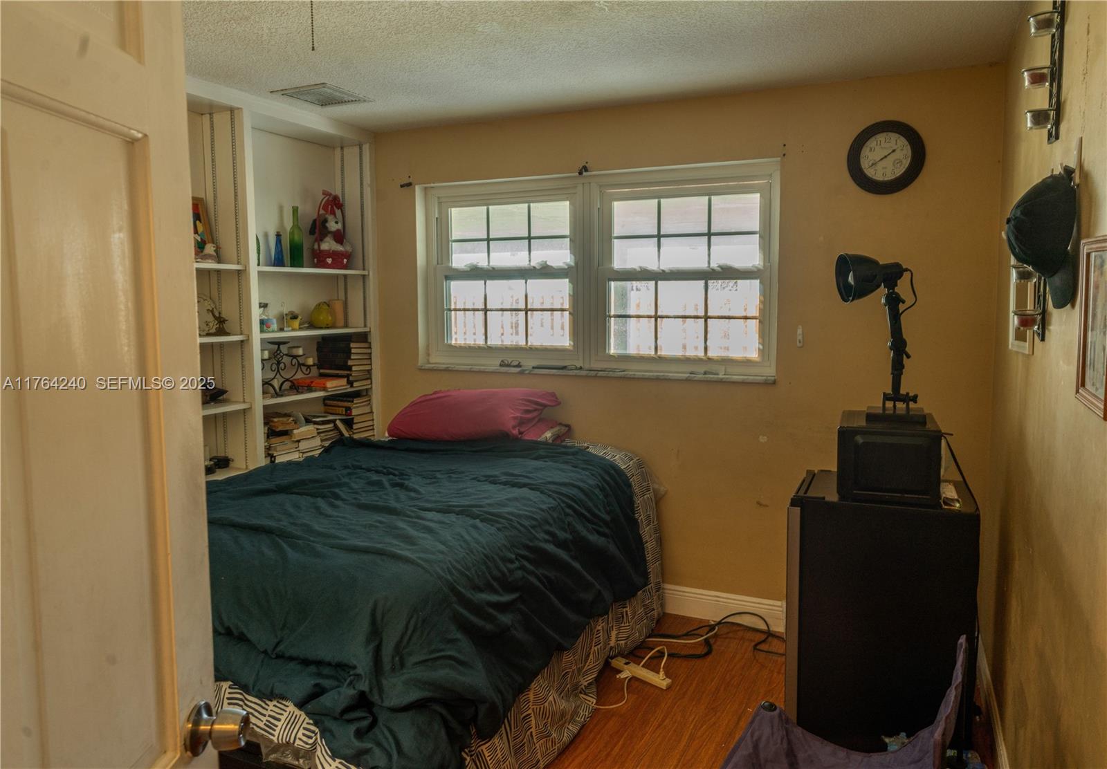315 Southwest 12th Avenue Boynton Beach, FL 33435 - Photo 16 of 37 a bedroom with a bed and a window
