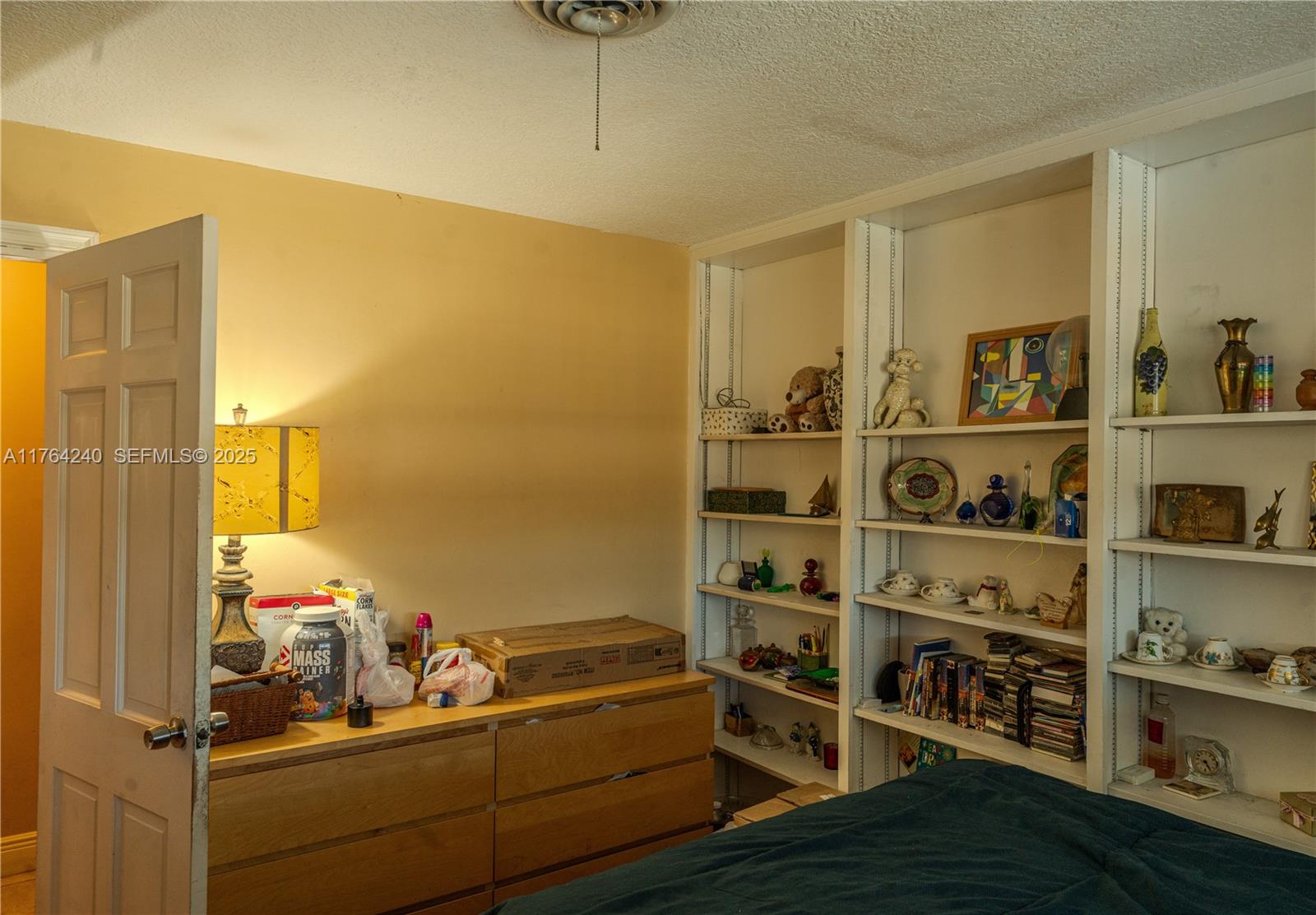 315 Southwest 12th Avenue Boynton Beach, FL 33435 - Photo 18 of 37 a view of a workspace room with shelves