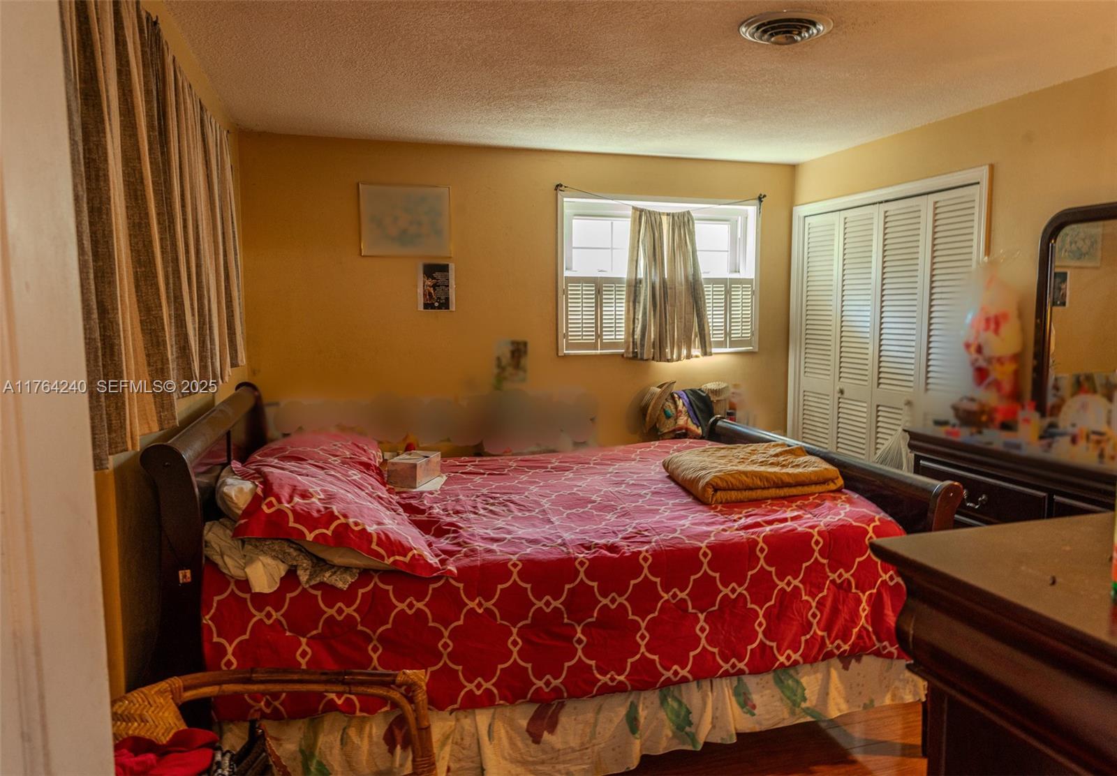 315 Southwest 12th Avenue Boynton Beach, FL 33435 - Photo 24 of 37 a bedroom with a bed and window