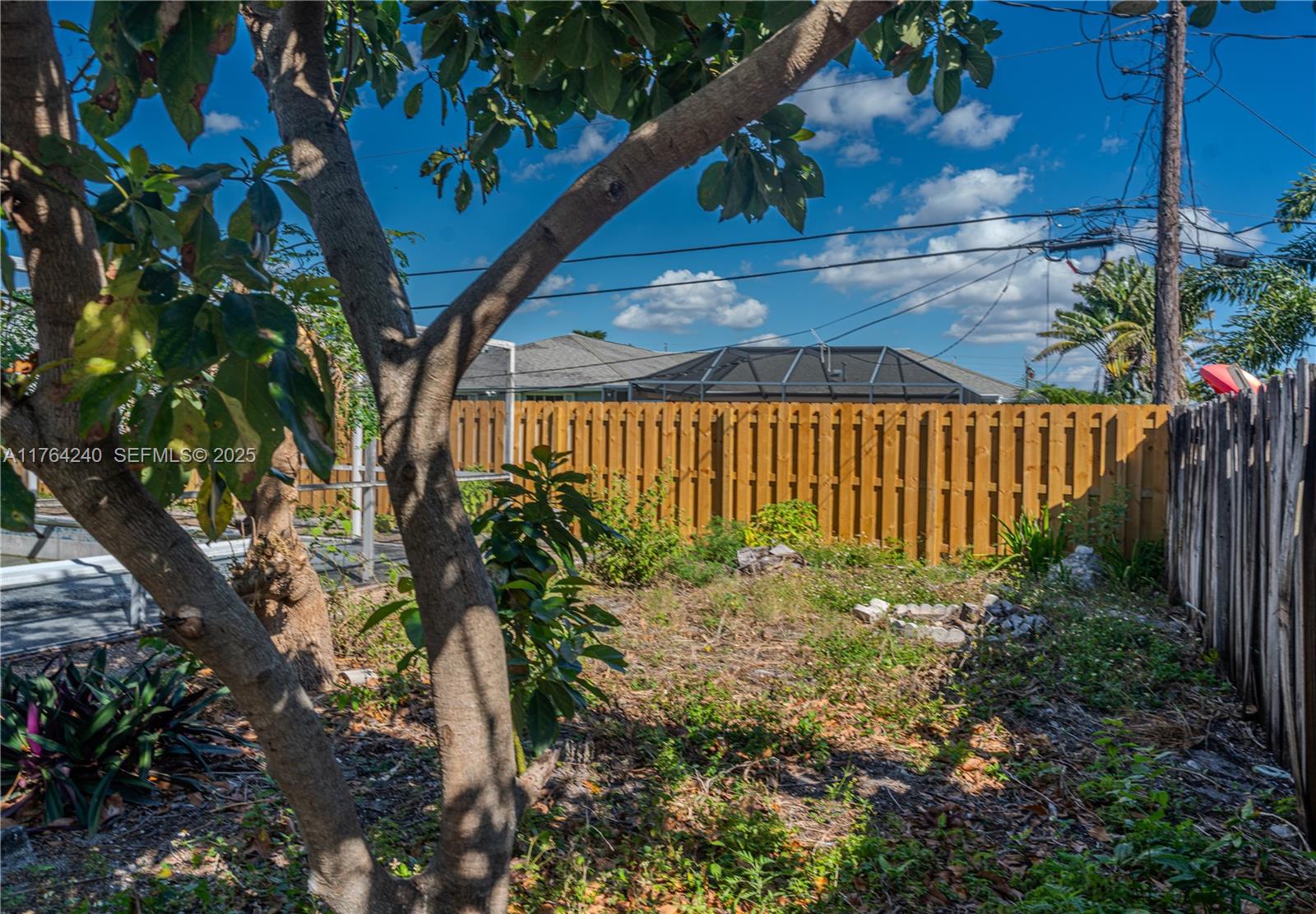 315 Southwest 12th Avenue Boynton Beach, FL 33435 - Photo 29 of 37 a backyard of a house with lots of green space