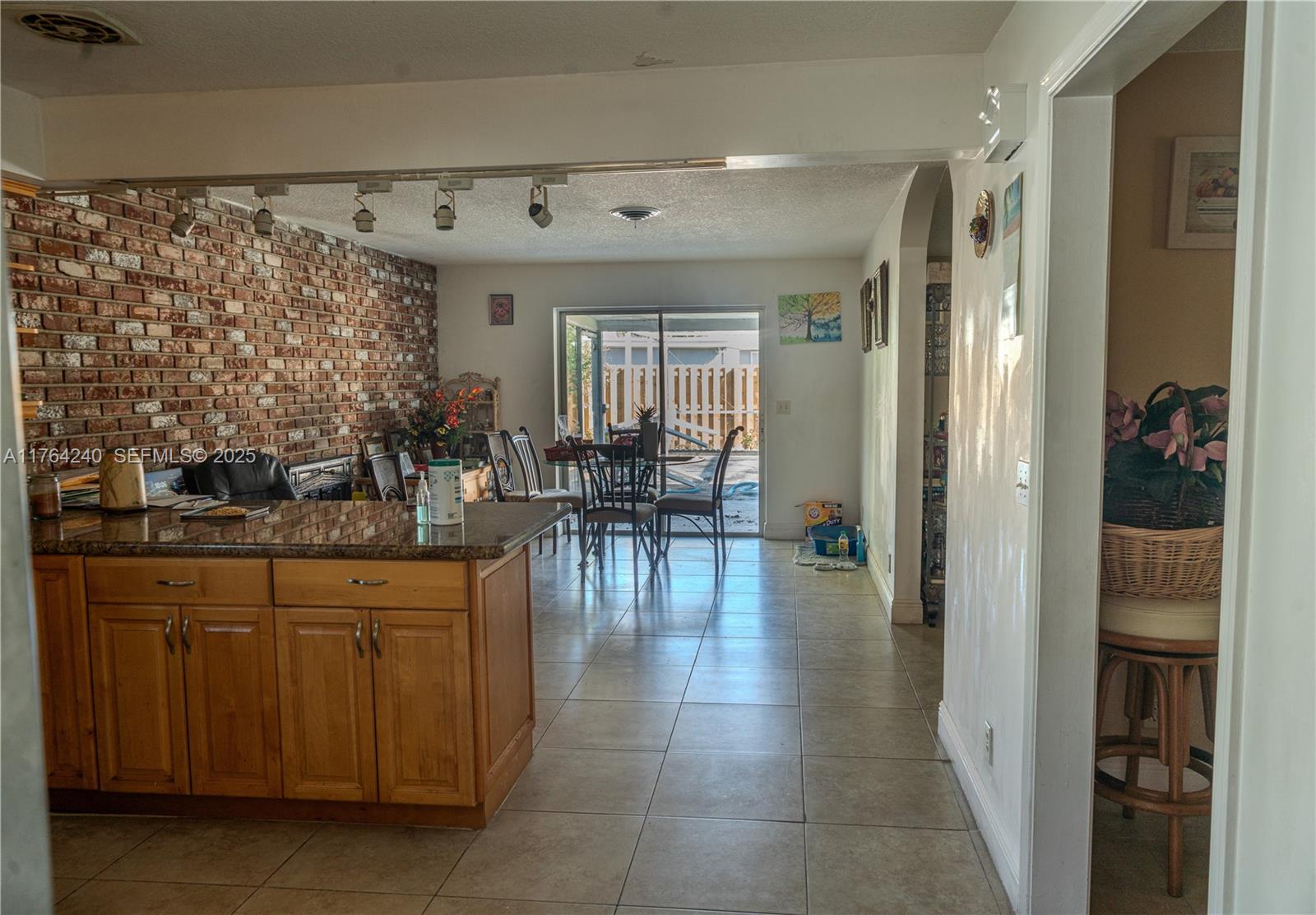 315 Southwest 12th Avenue Boynton Beach, FL 33435 - Photo 3 of 37 a dining hall with stainless steel appliances granite countertop a coffee maker a sink and a refrigerator