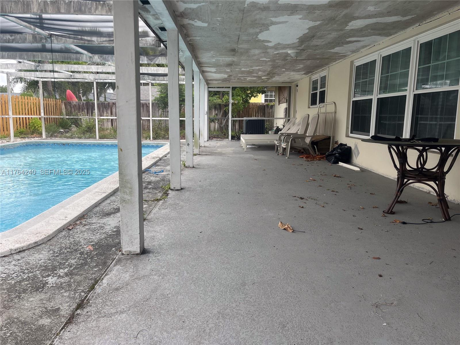 315 Southwest 12th Avenue Boynton Beach, FL 33435 - Photo 33 of 37 a view of a house with backyard porch and sitting area