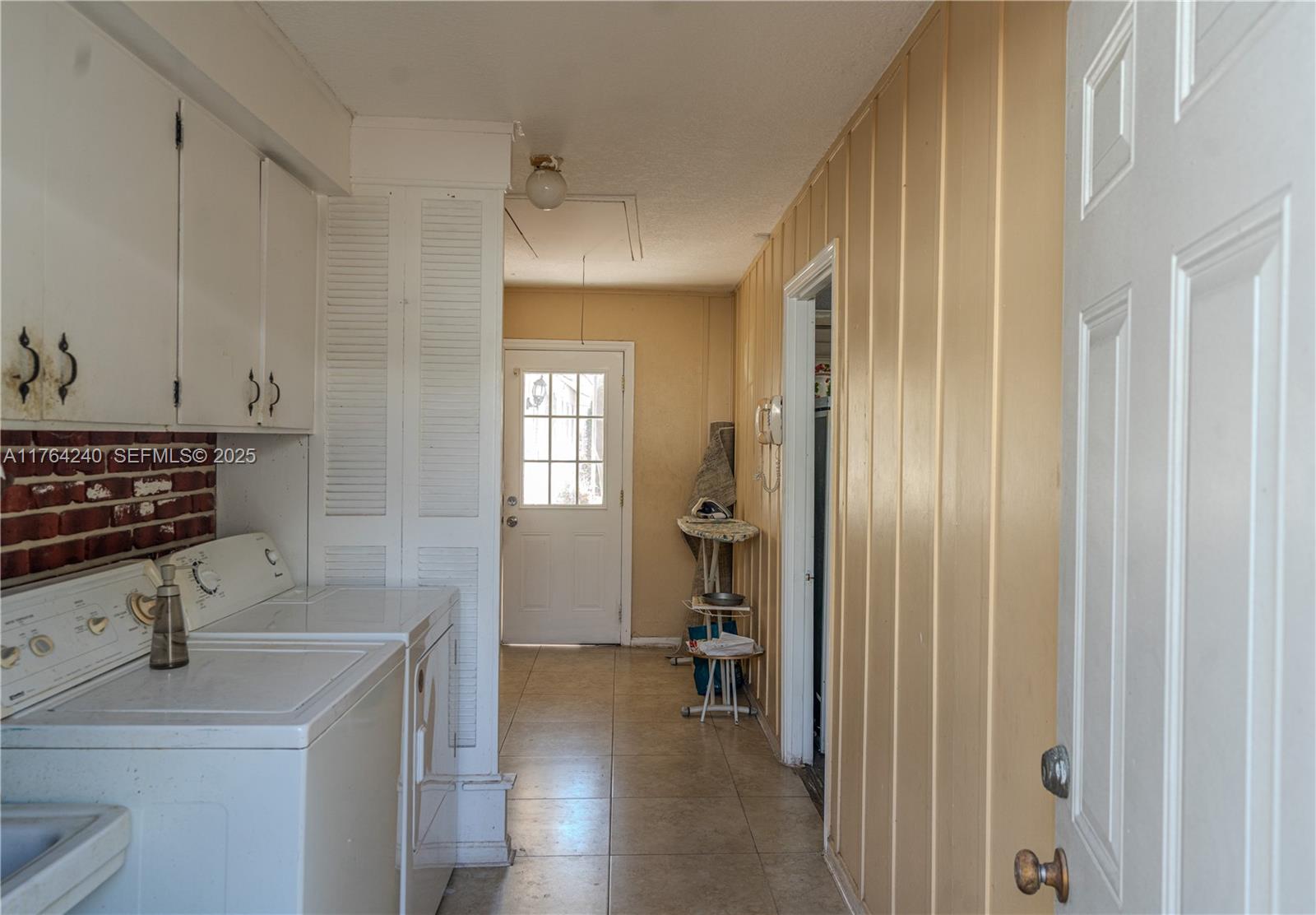 315 Southwest 12th Avenue Boynton Beach, FL 33435 - Photo 35 of 37 a view of a kitchen from a hallway