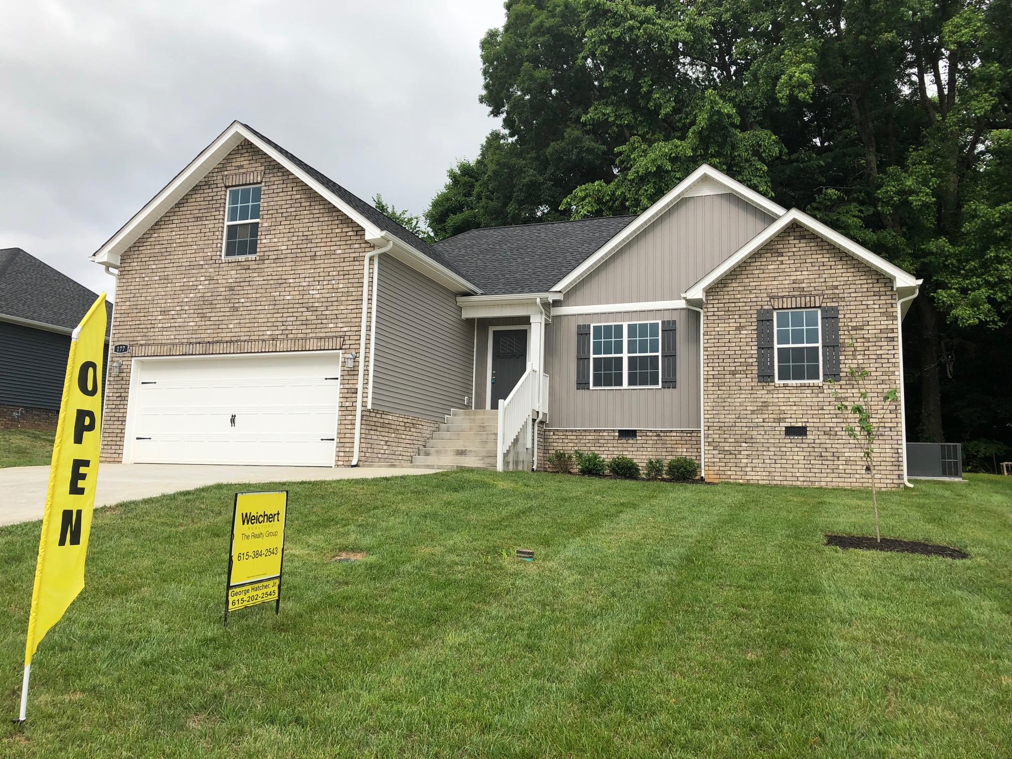 177 Fieldstone Lane Springfield, TN 37172 - Photo 1 of 27 a front view of a house with a yard and garage