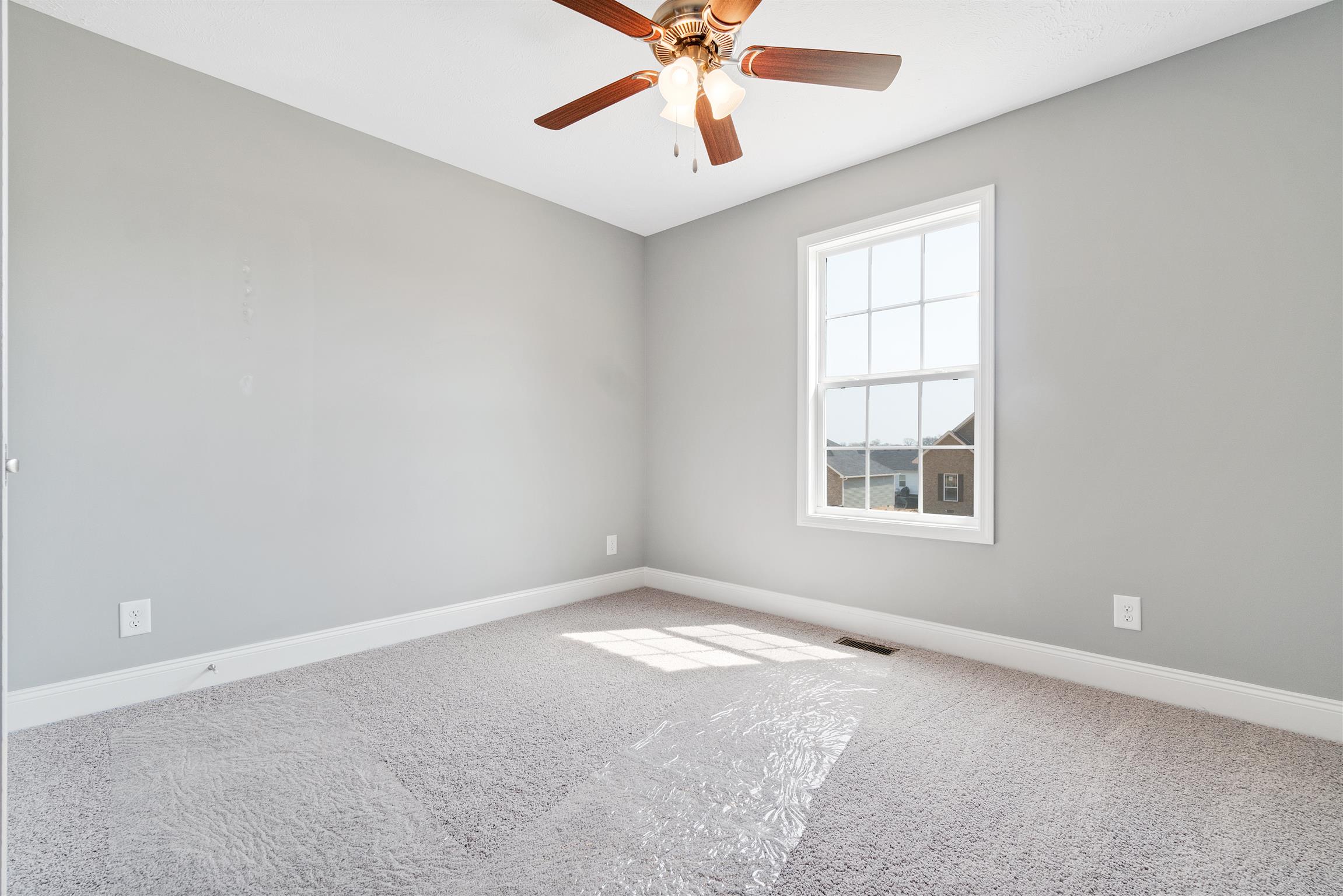 177 Fieldstone Lane Springfield, TN 37172 - Photo 12 of 27 an empty room with windows and fan