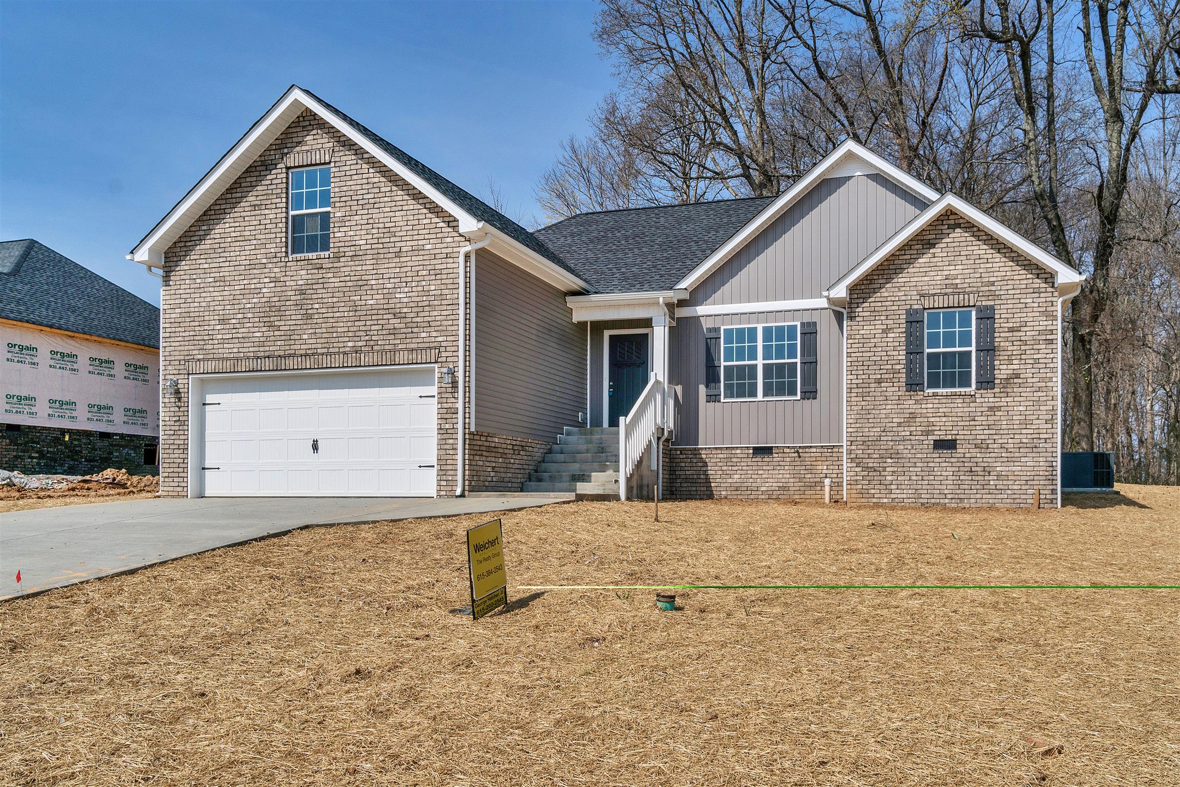 177 Fieldstone Lane Springfield, TN 37172 - Photo 2 of 27 a front view of a house with a yard and garage