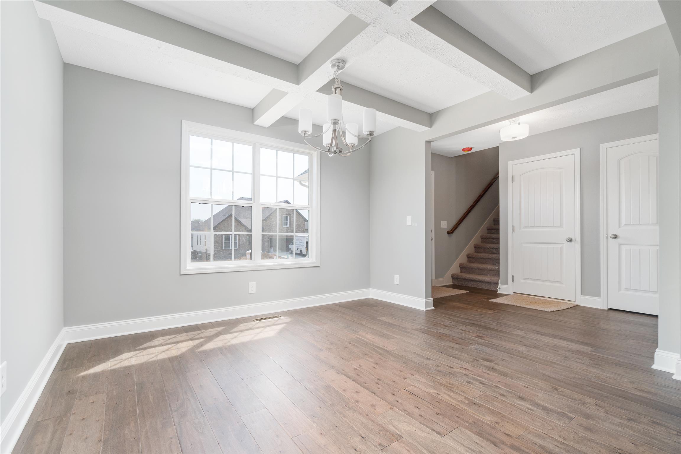 177 Fieldstone Lane Springfield, TN 37172 - Photo 27 of 27 an empty room with wooden floor staircase and windows