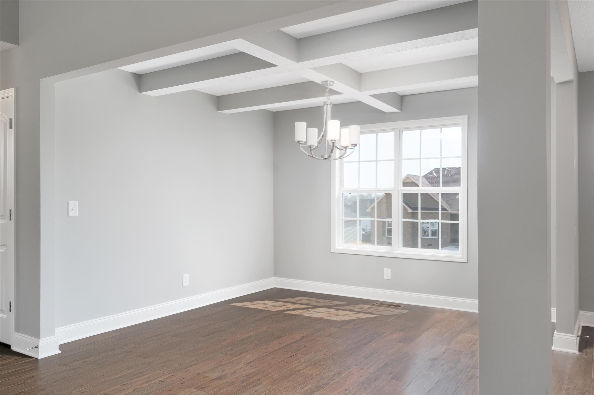 177 Fieldstone Lane Springfield, TN 37172 - Photo 9 of 27 an empty room with wooden floor and windows