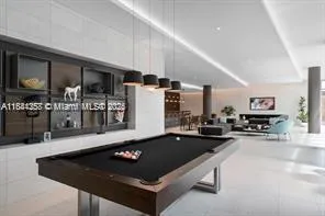 a kitchen with counter top space a sink and appliances