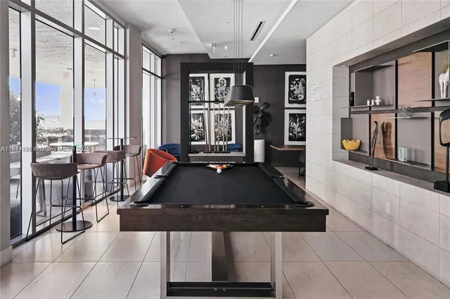 a lobby with furniture and floor to ceiling window