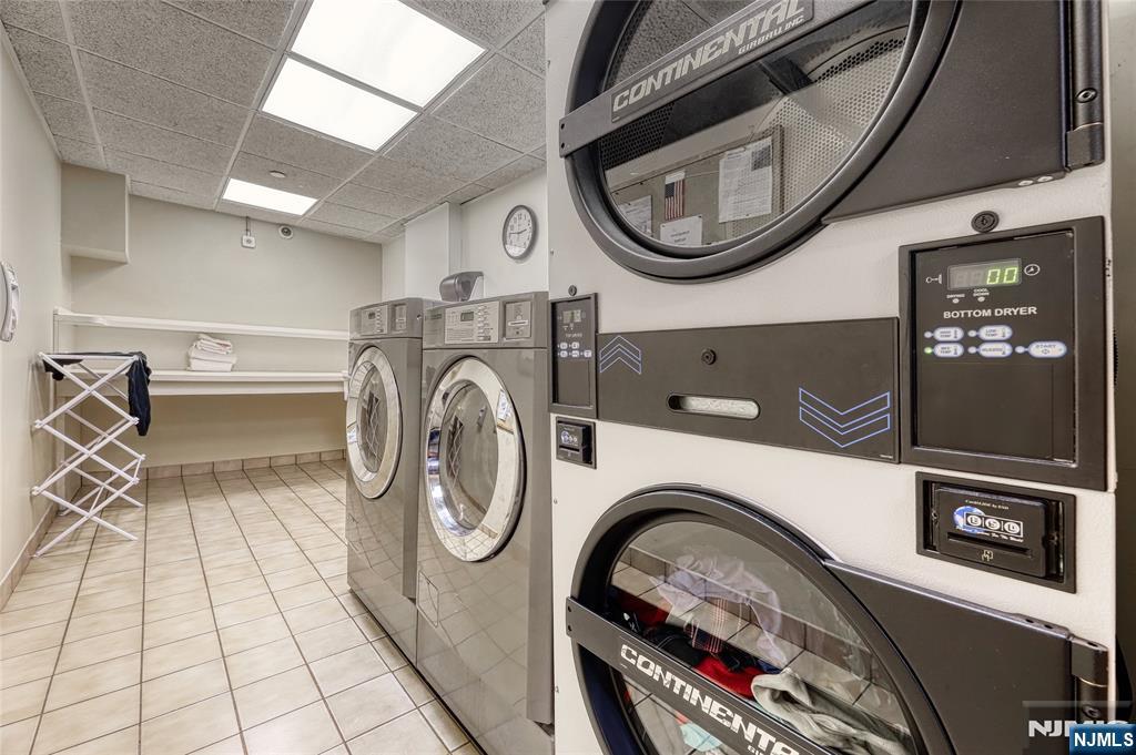 100 East Palisade Avenue, Unit D34 Englewood, NJ 07631 - Photo 11 of 12 a utility room with dryer and washer