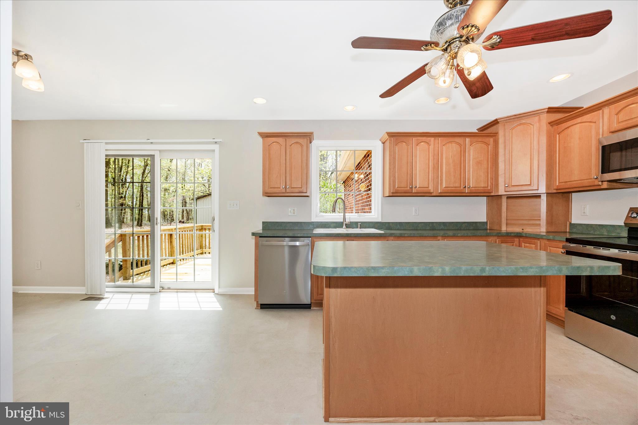 10393 Liberty Road Frederick, MD 21701 - Photo 22 of 47 a kitchen with stainless steel appliances granite countertop a stove a sink and a microwave