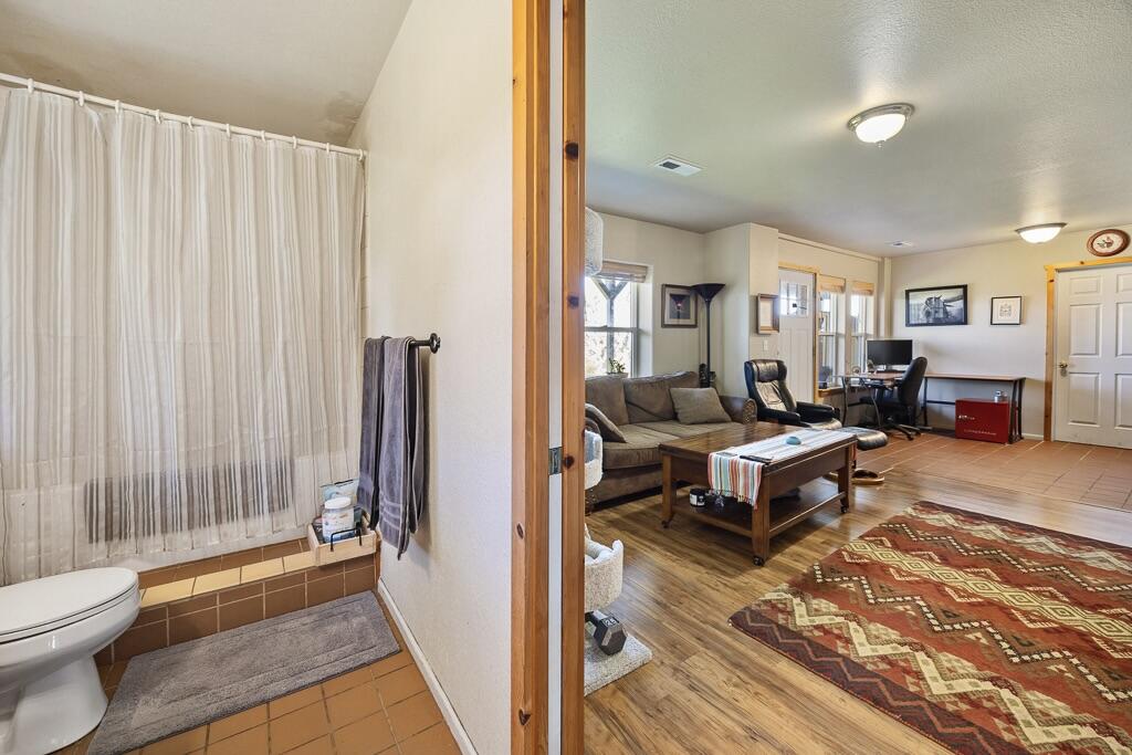 13351 Crystal Springs Road Klamath Falls, OR 97603 - Photo 44 of 51 a living room with furniture a rug and a shower