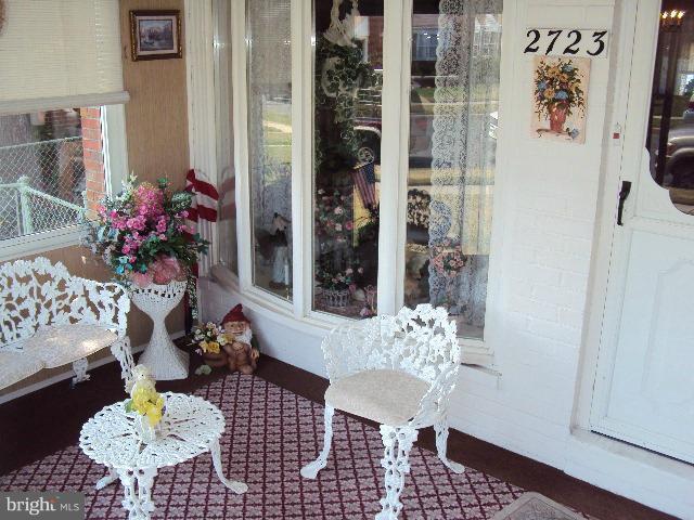 2723 Kirkleigh Road Baltimore, MD 21222 - Photo 10 of 19 Enclosed Front Porch