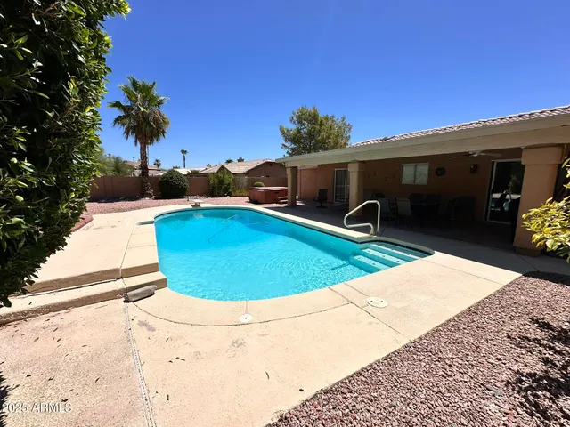 a view of a swimming pool with a patio
