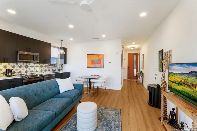 a kitchen with a sink stove and microwave