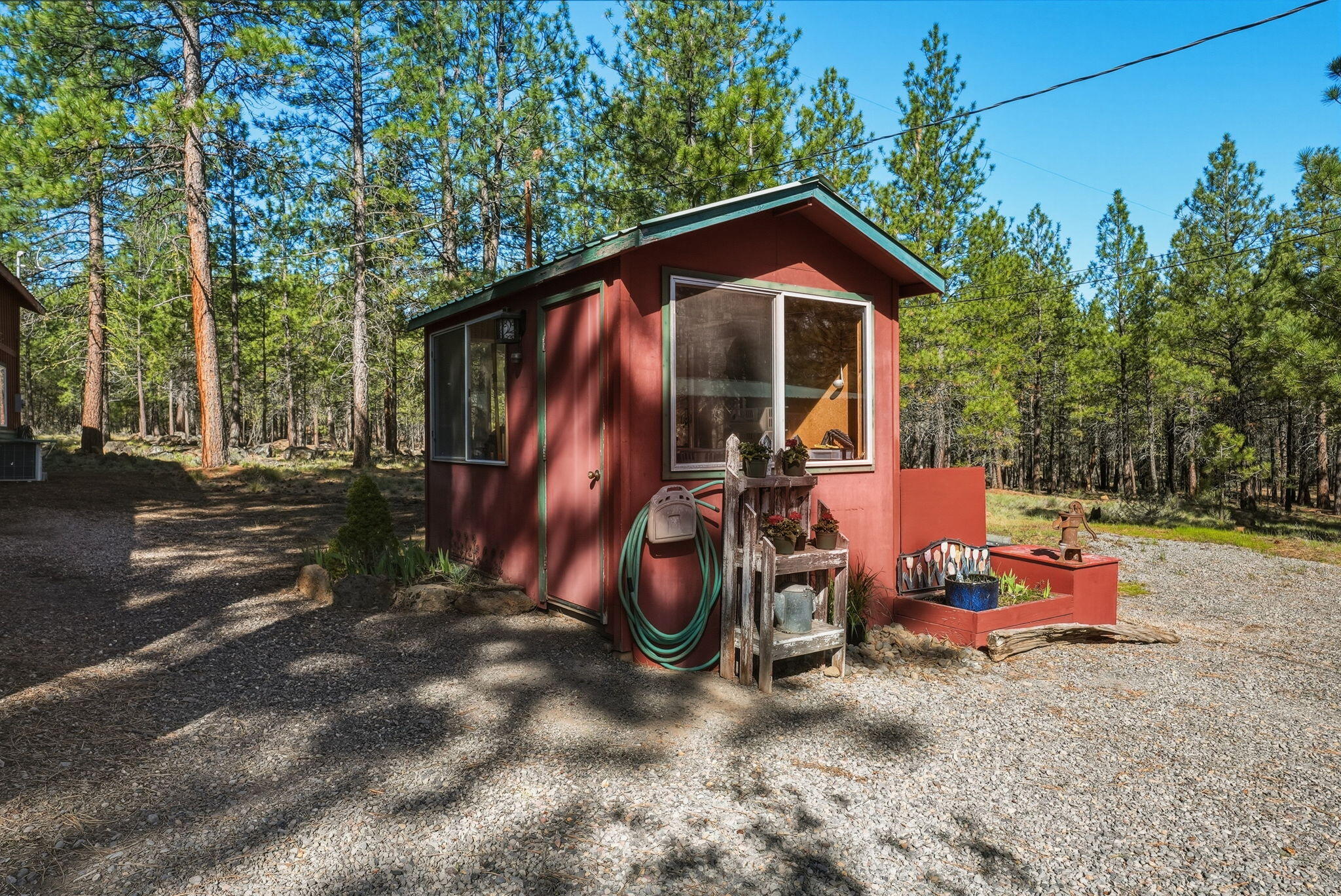 15020 Remuda Road Sisters, OR 97759 - Photo 51 of 61 7'x11' pump house with well head, pressure tank and greenhouse shelving