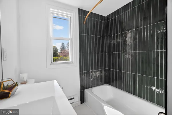 a bathroom with a toilet and shower