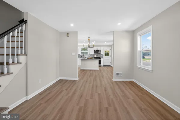 a view of kitchen and wooden floor