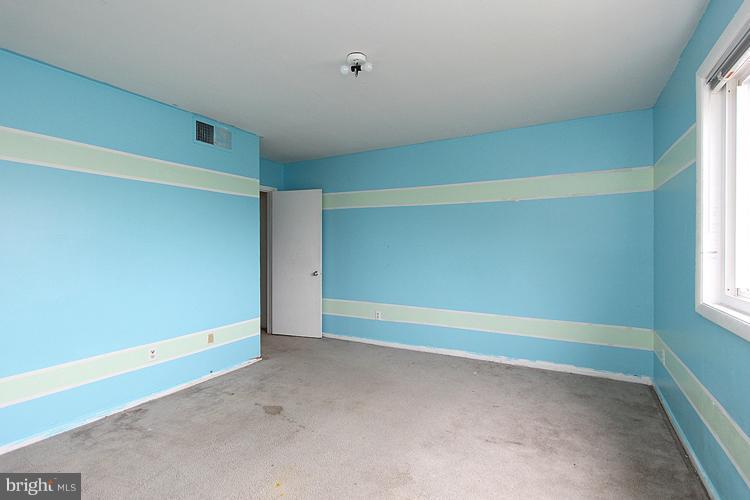 3122 Brinkley Road, Unit 303 Temple Hills, MD 20748 - Photo 12 of 30 a view of an empty room with a window