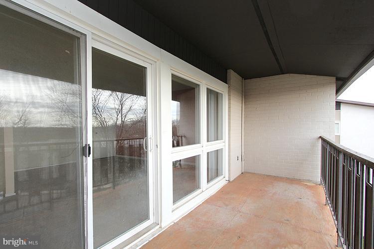 3122 Brinkley Road, Unit 303 Temple Hills, MD 20748 - Photo 14 of 30 a view of an empty room with a window