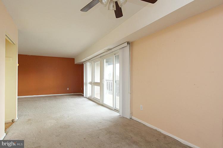 3122 Brinkley Road, Unit 303 Temple Hills, MD 20748 - Photo 17 of 30 wooden floor in an empty room with a window