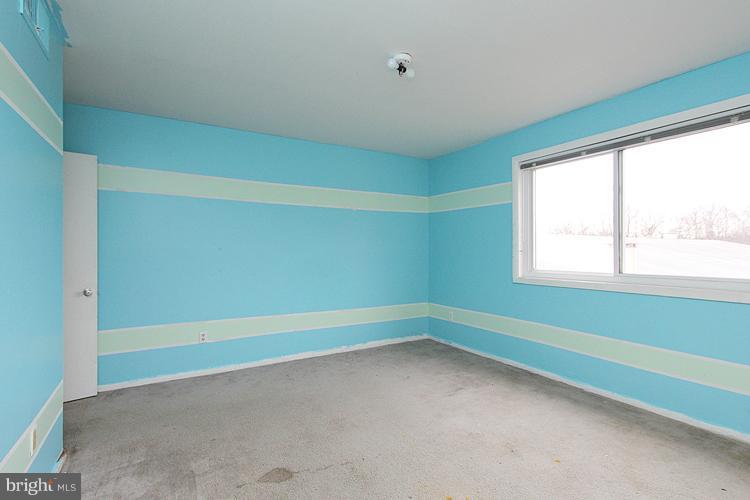 3122 Brinkley Road, Unit 303 Temple Hills, MD 20748 - Photo 19 of 30 a view of an empty room with a window