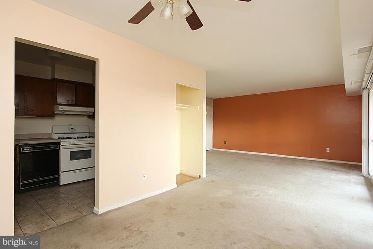 3122 Brinkley Road, Unit 303 Temple Hills, MD 20748 - Photo 3 of 30 a view of an empty room with a kitchen