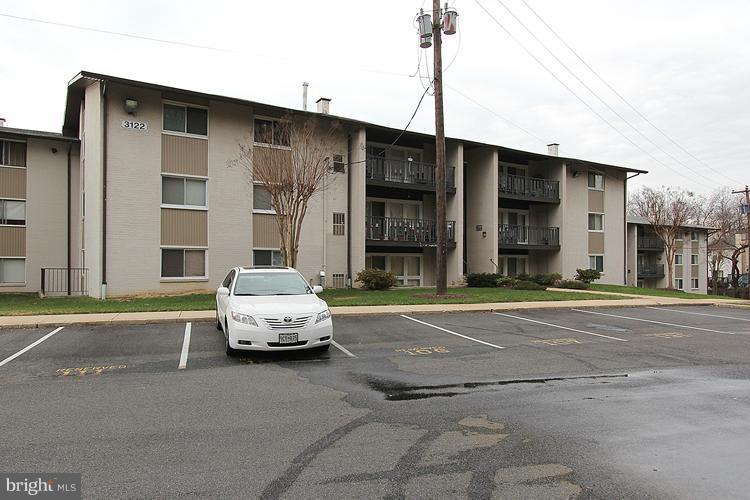 3122 Brinkley Road, Unit 303 Temple Hills, MD 20748 - Photo 22 of 30 a car parked in front of a building