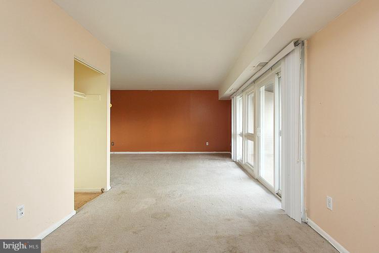 3122 Brinkley Road, Unit 303 Temple Hills, MD 20748 - Photo 24 of 30 a view of an empty room with a window