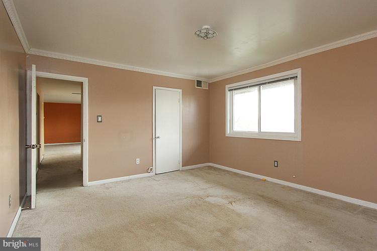 3122 Brinkley Road, Unit 303 Temple Hills, MD 20748 - Photo 28 of 30 an empty room with windows and closet