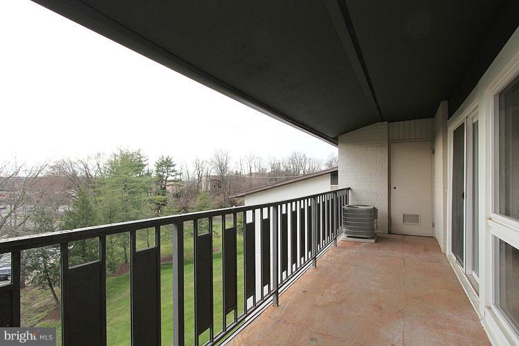 3122 Brinkley Road, Unit 303 Temple Hills, MD 20748 - Photo 29 of 30 a view of a balcony with wooden floor