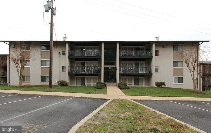 3122 Brinkley Road, Unit 303 Temple Hills, MD 20748 - Photo 30 of 30 a view of a brick building with a large windows