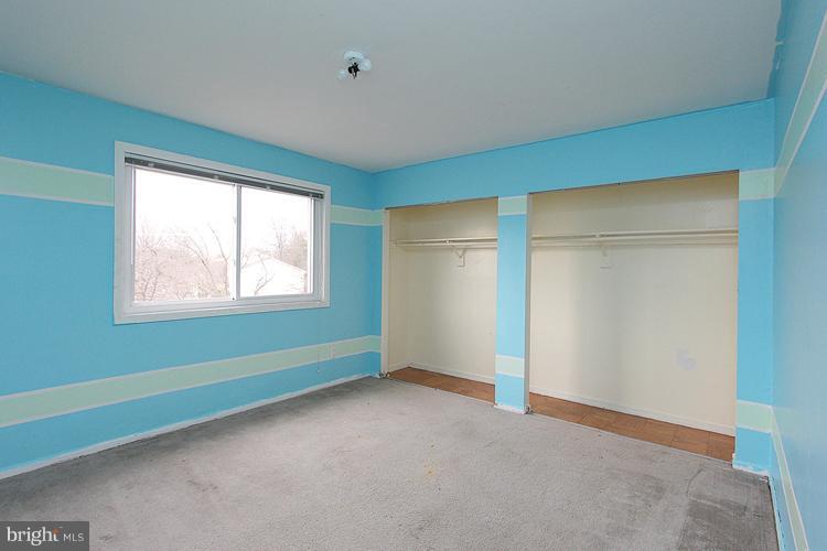 3122 Brinkley Road, Unit 303 Temple Hills, MD 20748 - Photo 5 of 30 a view of an empty room with a window