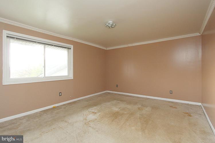 3122 Brinkley Road, Unit 303 Temple Hills, MD 20748 - Photo 6 of 30 a view of an empty room with a window