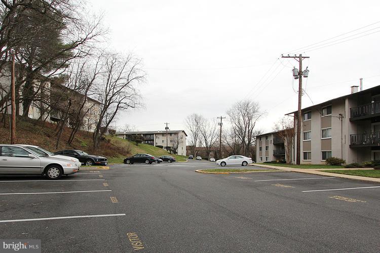 3122 Brinkley Road, Unit 303 Temple Hills, MD 20748 - Photo 8 of 30 a view of road with cars