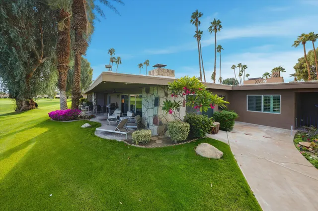 a view of a table and chairs in patio with a fire pit