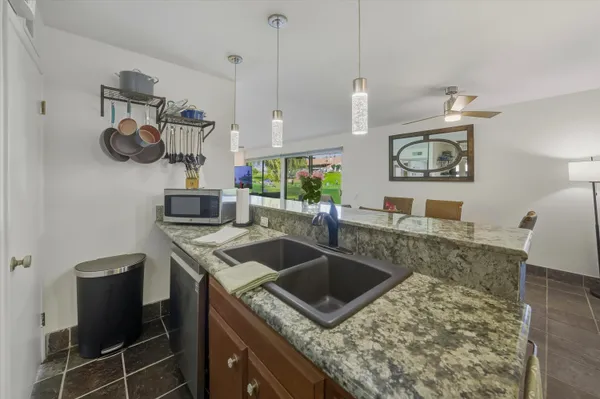 a living room with furniture and a yard