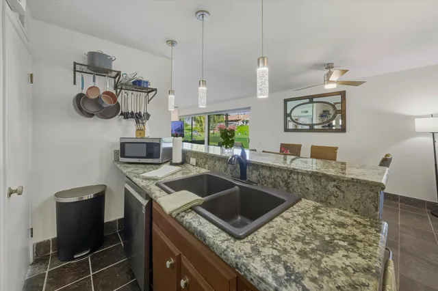 a living room with furniture and a yard