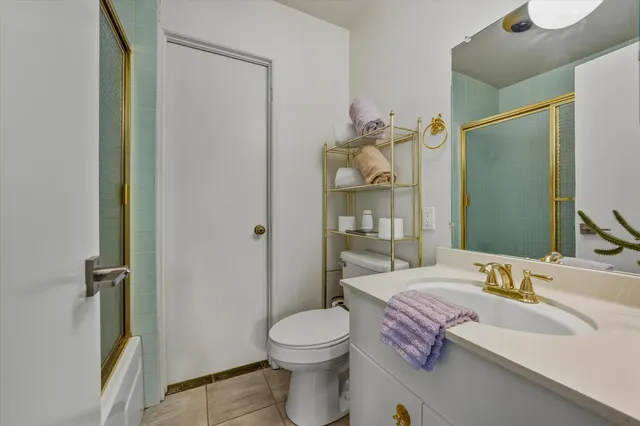 a view of a chairs and table in patio with a yard